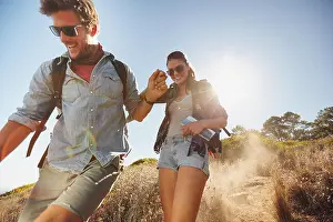 Pursuit Prints: Outdoor shot of happy young couple enjoying on their hiking trip