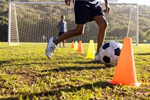 Practicing Prints: Outdoors, dribbling soccer ball through cones