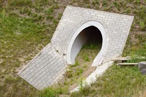 Expressway Prints: The outlet of the concrete channel draining excess water from the road