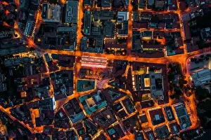 Aerial Cityscape Prints: Overhead aerial drone night shot of city street lights in Lugano, Switzerland