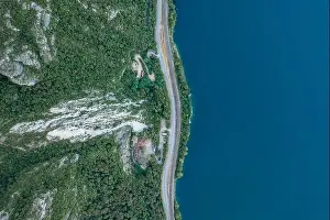 Aerial Cityscape Prints: Overhead aerial drone shot lakeside road between Monte Salvatore and Lugano Lake