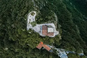 Aerial Cityscape Prints: Overhead aerial drone shot view of top of monte salvatore with chapel and observatory in Lugano
