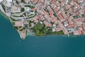 Lake Garda Prints: Overhead aerial drone shot view of village Malcesine coastline by lake garda