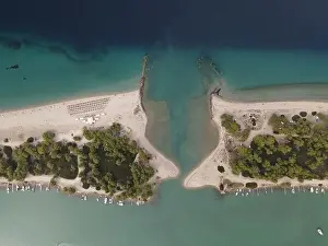 Surfers Prints: Overhead drone photo over the tropical blue ocean and the bay of Glarokavos in Paliouri