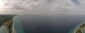 Surfers Prints: Overhead drone photo over the tropical blue ocean and the bay of Glarokavos in Paliouri