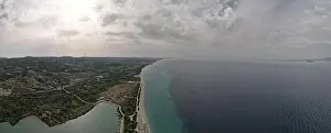 Surfers Prints: Overhead drone photo over the tropical blue ocean and the bay of Glarokavos in Paliouri
