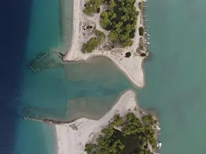 Surfers Prints: Overhead drone photo over the tropical blue ocean and the bay of Glarokavos in Paliouri