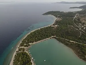 Surfers Prints: Overhead drone photo over the tropical blue ocean and the bay of Glarokavos in Paliouri