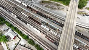 Charles Bridge Prints: An overhead drone shot captures the railroad tracks as a train passes through