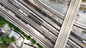 Charles Bridge Prints: An overhead drone shot captures the railroad tracks as a train passes through