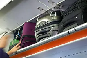 Fuselage Prints: Overhead passenger locker / lockers / compartment / compartments for stowing passengers bags cabin luggage on an