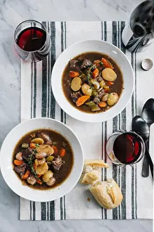 Overhead View Prints: Overhead view of beef stew with wine and bread on table