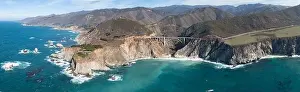 The Pacific Ocean washes onto the beautiful seashore of California, not far south of Monterey. The Pacific Coast Highway runs right along this region