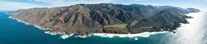 The Pacific Ocean washes onto the beautiful seashore of California, not far south of Monterey. The Pacific Coast Highway runs right along this region