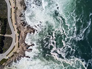 The Pacific Ocean washes against the rocky and scenic coastline of the Monterey peninsula in California