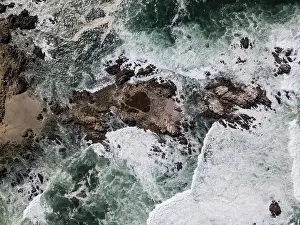 The Pacific Ocean washes against the rocky and scenic coastline of the Monterey peninsula in California