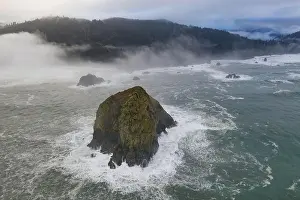 The Pacific Ocean washes against rugged sea stacks found just off the scenic coast of Northern California in Klamath