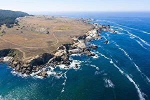Aerial Landscape Collection: The Pacific Ocean washes along the rugged shoreline of Northern California on a calm day