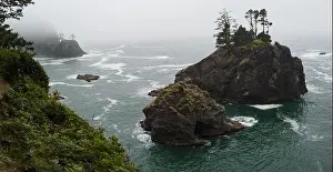 The Pacific Ocean washes against the scenic coastline of southern Oregon. This rugged part of the Pacific Northwest is found along highway 101