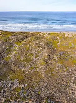 The Pacific Ocean washes against the seashore of Central California in Morro Bay. This beautiful coastal region is known for its scenic beaches