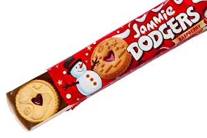 Tempting Prints: Packet of Jammie Dodgers raspberry flavour biscuits tis the season to be jammie family pack opened to show Xmas