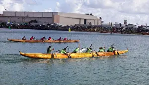 Paddlers race to the finish line during the “Na Koa Lani” canoe race aboard Marine Corps Air Station Kaneohe Bay