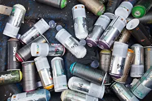 Top Down Prints: Empty paint spray cans used for graffiti and street art in a trash can in Nantes, France