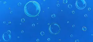 Childlike Prints: Painted soap bubbles on a blue wall