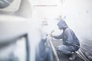 Paintwork Prints: painter posing in front of the booth before painting a car