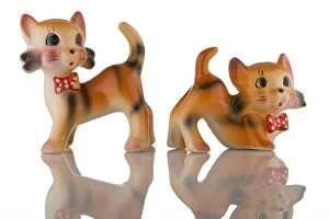 Kitsch Collection: A pair of china kittens with red spotted bow ties