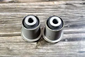Isolate Prints: A Pair of lower control arm bushings for a vehicle
