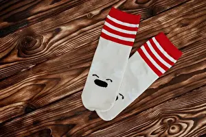 Toes Prints: A pair of socks featuring a polar bear design are displayed against a white background
