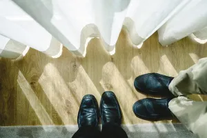 Formalwear Prints: Two pairs of feet with their black shoes facing, viewed from above