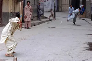 Motion Blur Prints: Pakistan, Peshawar. Group of young pakistani teenage boys dressed in grey & white punjabi suits