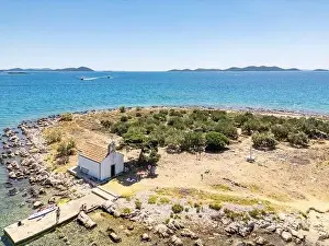 Pakostane, Croatia - July 27, 2024: Little island with little chapel near Pakostane city in Croatia