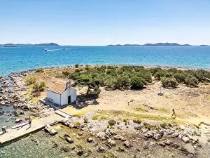 Pakostane, Croatia - July 27, 2024: Little island with little chapel near Pakostane city in Croatia