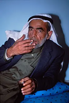 Habit Prints: Palestinian man smoking at his home Rafah Gaza strip, palestine