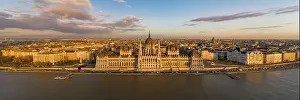 Panorama aerial drone shot of Hungarian Parliament facade during Budapest sunset