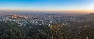 Panorama Aerial drone shot of Tibidabo Mountain with city view of Barcelona during sunset