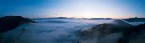 Panorama Aerial view Drone shot of Beautiful scenery landscape sunlight in the morning sunrise above flowing fog waves