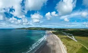 A panorama aerial view of the endless golden sand beach in Ballybunion on the west coast of Ireland
