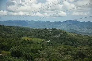 Observation Tower Prints: Panorama drone shot over rainforest on Flores with green hills in background