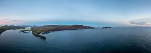 panorama drone view of the Iveragh Peninsula with Valentia Island and Portmagee at sunset