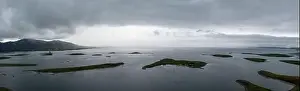Panorama landscape of the sunken drumlin islands of Clew Bay in County Mayo with a rain storm moving in