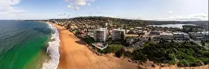 panorama of narrabeen beach and lagoon on a sunny day with apartments on the beach