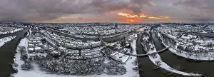 Stone Bridge Prints: Panorama of Regensburg city in Bavaria with the river Danube the cathedral and the stone bridge in winter with ice