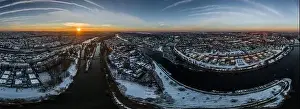 Stone Bridge Prints: Panorama of Regensburg city in Bavaria with the river Danube the cathedral and the stone bridge in winter with ice