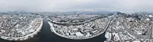 Panorama of Regensburg city in Bavaria with the river Danube the cathedral and the stone bridge in winter with snow