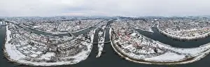 Panorama of Regensburg city in Bavaria with the river Danube the cathedral and the stone bridge in winter with snow