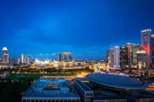 Panorama of Singapore business district skyline and office skyscraper at night in Marina bay, Singapore. Asian tourism, modern city life, or business